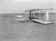 Wilbur Wright in Damaged Aircraft 