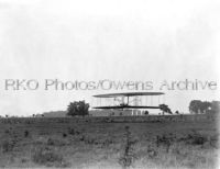 Wilbur Wright flying close to the ground