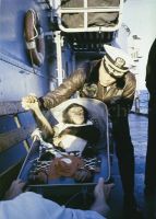 Chimpanzee Ham is greeted by ships commander after Mercury flight