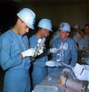 The crew of Apollo 204 inspect flight equipment, June 24, 1966