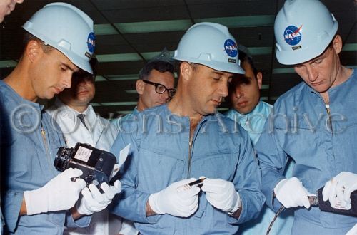 Apollo 204 mission inspect spacecraft equipment at a tour of North American Aviation