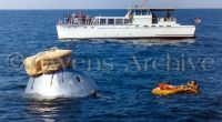 Crew of Apollo 1 relaxing in life raft during water egress training