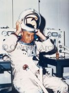 Astronaut Virgil I. Grissom takes off his helmet prior to the first manned altitude test