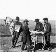  Newspaper vendor and cart in camp at Virginia