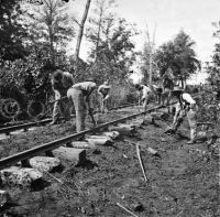 African Americans repairing railroad track