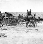 Federal soldiers removing Confederate artillery