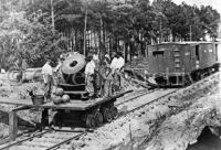 Soldiers with cannon on railroad car