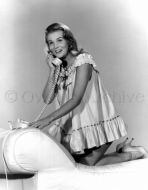 Ann Margret wearing nightgown and high heels