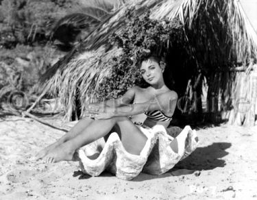 Joan Collins wearing swimsuit