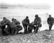 Medic with Special Engineer Brigade help survivors, Omaha Beach