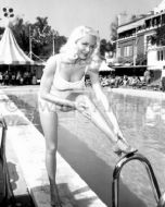Lana Turner wearing swimsuit