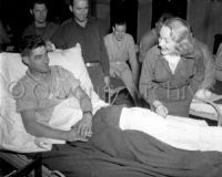Actress Marlene Dietrich with wounded troops, Belgium