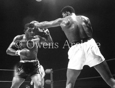 Muhammad Ali throwing punch at Floyd Patterson