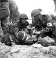 Medics with 3rd Canadian Infantry Division Help Wounded