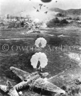 Parachute bombs over Japanese airfield