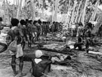 New Guinea natives help wounded troops
