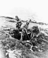 Soldiers fire mortar shells at Japanese positions 