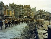 1st Infantry Division marching through British port, June 5, 1944