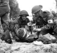 Canadian medics help wounded soldiers, Battle of Caen
