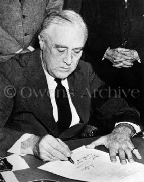 FDR signing the declaration of war