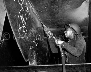 Rosie the Riveter Working on Liberty Ship