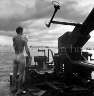 PT Boat crewman cleaning up