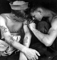 Sailor is getting a tatto on USS New Jersey