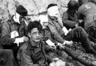 Wounded soldiers from 16th Infantry Regiment, Omaha Beach