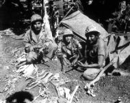 Navajo Indians helping Marines find Japanese soldiers, Saipan
