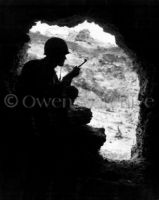 Marine rifleman in cave, Okinawa 