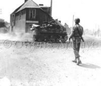 M7 Priest with 3d Infantry at Crossroad Caumont, France