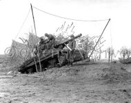 2nd Armored Division Tank Aims Shells Across Roer River