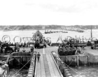 Tanks and vehicles unload and head to Omaha beach