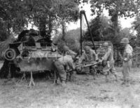 US Soldiers Repair Damaged Sherman Tank