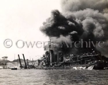 USS Shaw (DD-373) burning on dry dock after attack