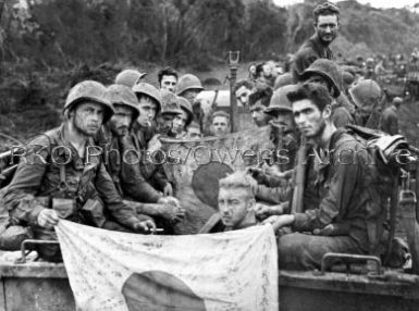 1st Marine Division hold captured flags 