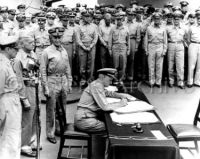 Admiral Nimitz signs Japan's surrender