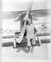 Pilot standing in front of airplane