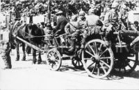 German soldiers on horse-drawn wagon