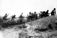 Australian troops charging at Turkish trench