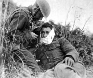 Soldier of Company K, receiving first-aid
