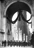 Soldiers march under Victory Arch